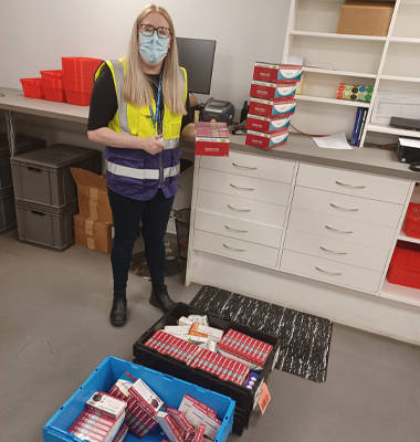 MWI Pharmacy, worker checking stock