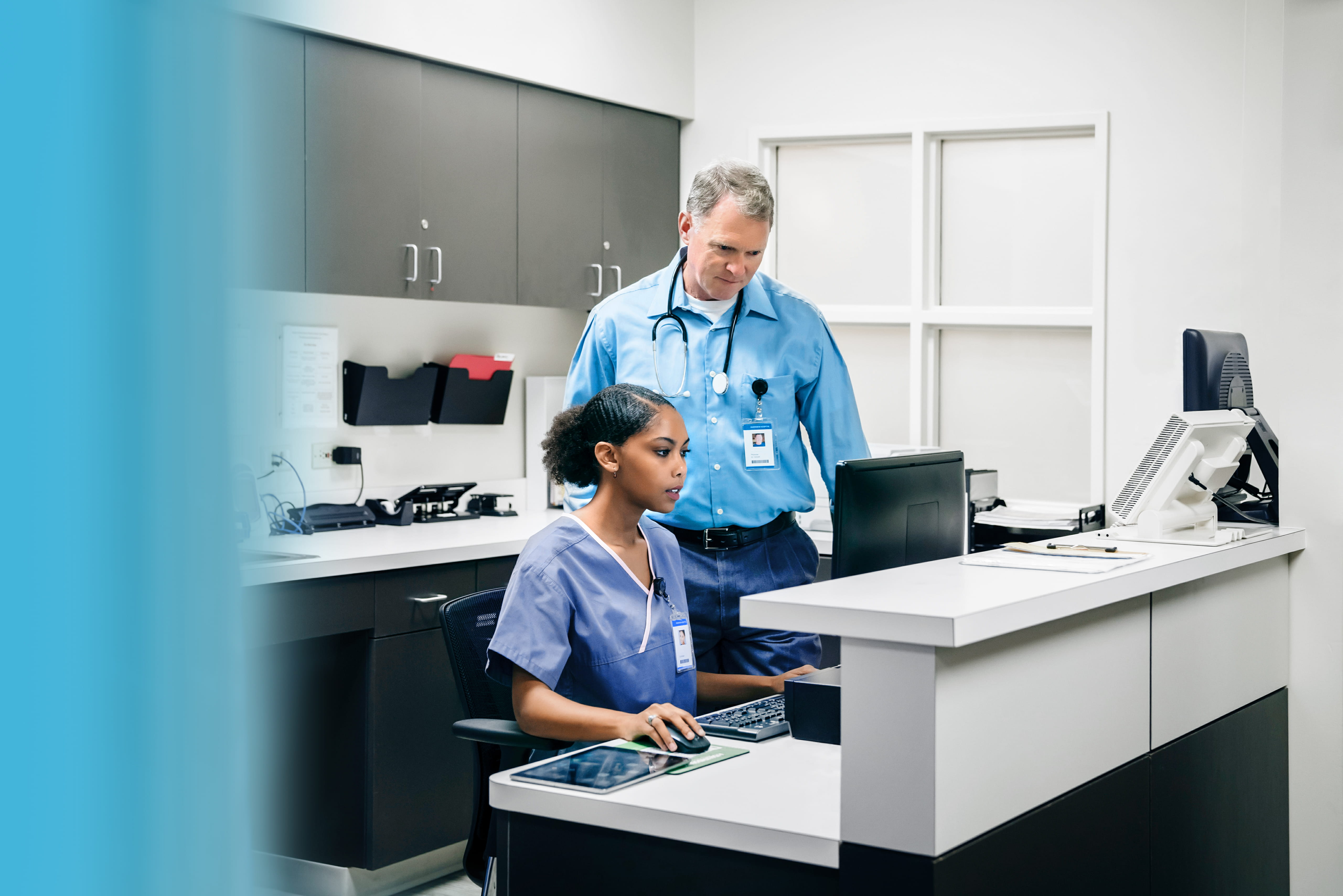 Doctor and nurse using computer in hospital