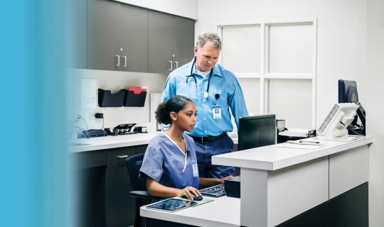 Doctor and nurse using computer in hospital