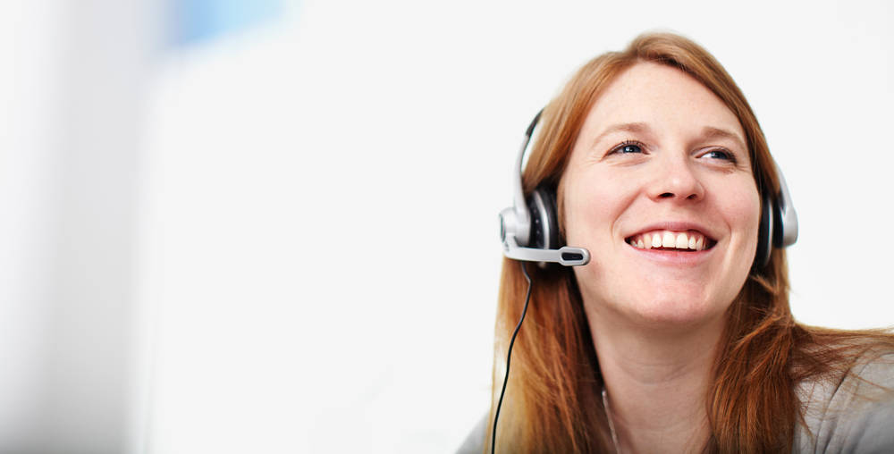 Female customer service representative wearing headset