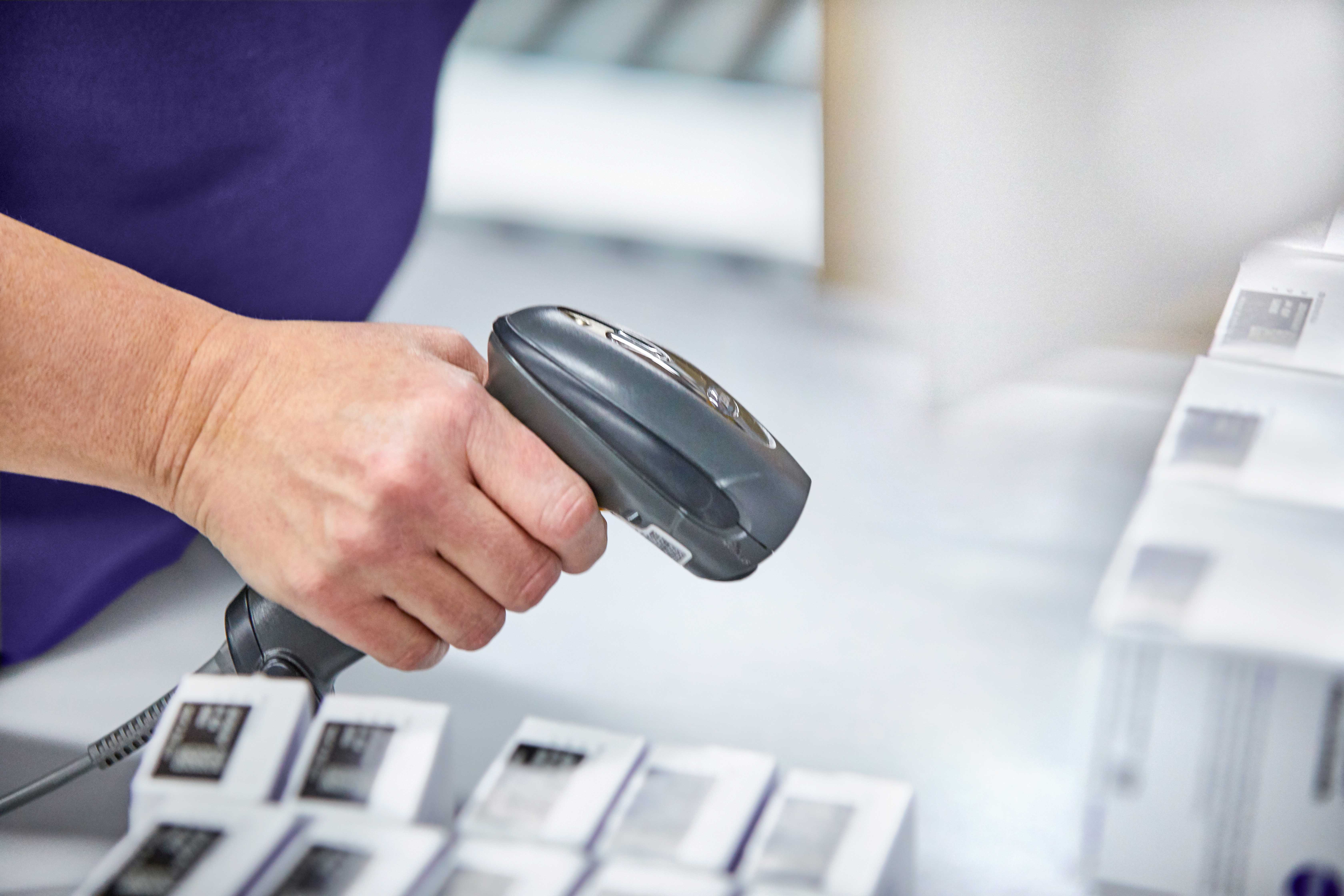 Products being scanned in a specialty distribution center