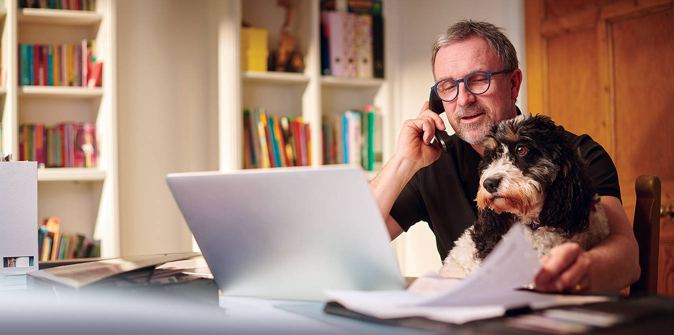 Man working from home with his dog